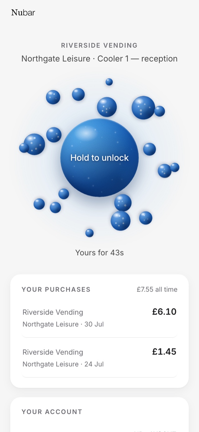 The unlock screen on a phone, naming the operator and the cooler, with a large blue circle reading Hold to unlock.